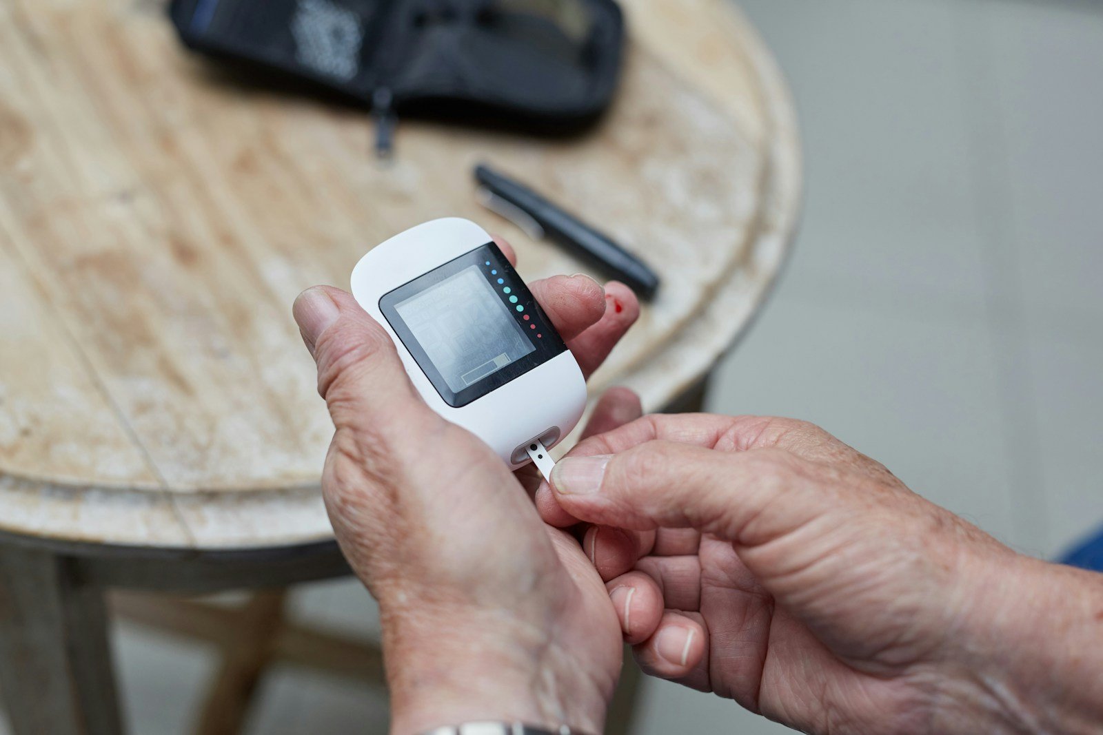 a person testing blood sugar