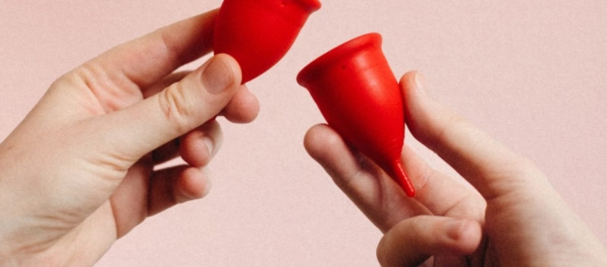 person holding red heart shape ornament